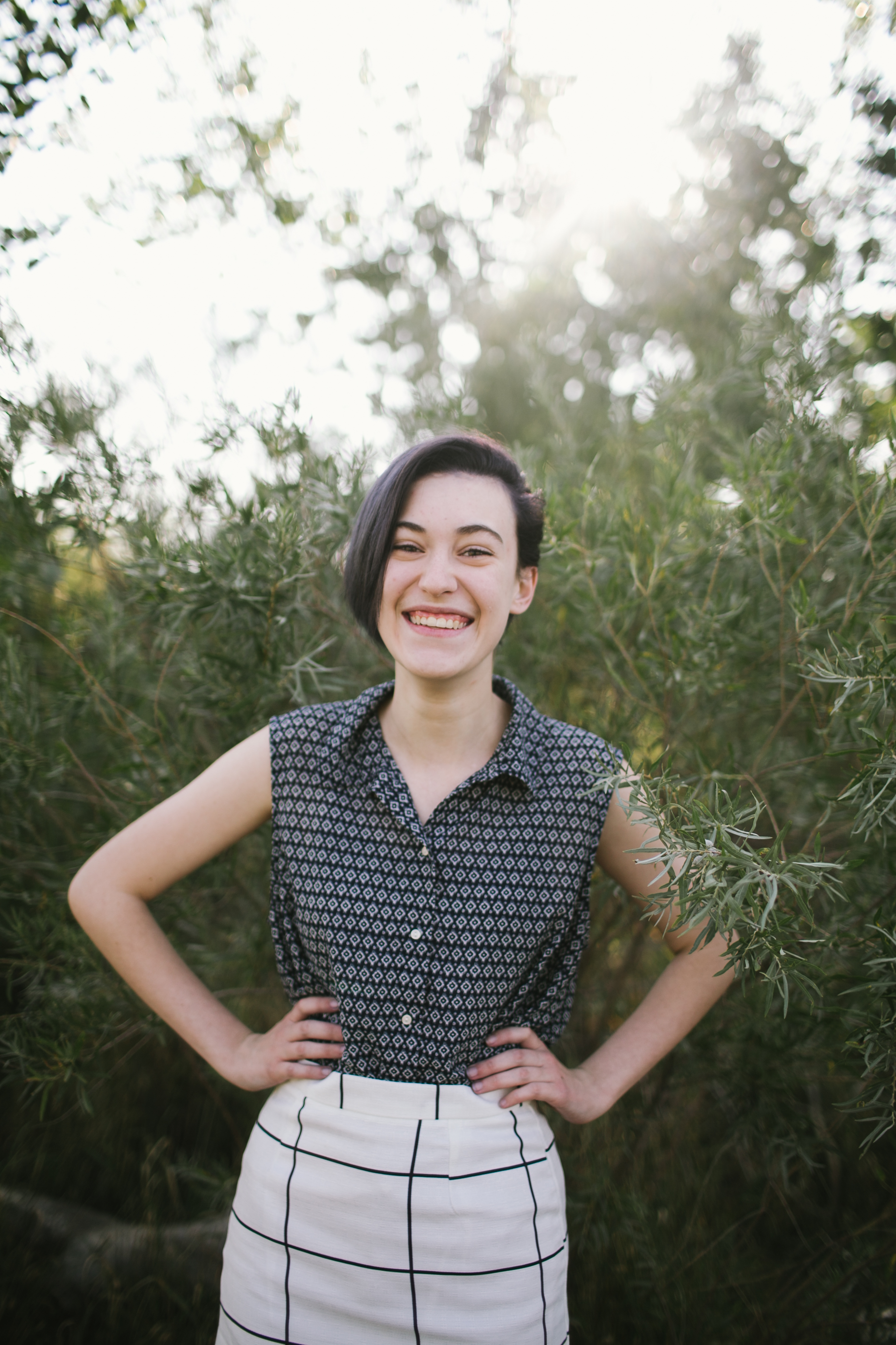 woman standing with hands on hips