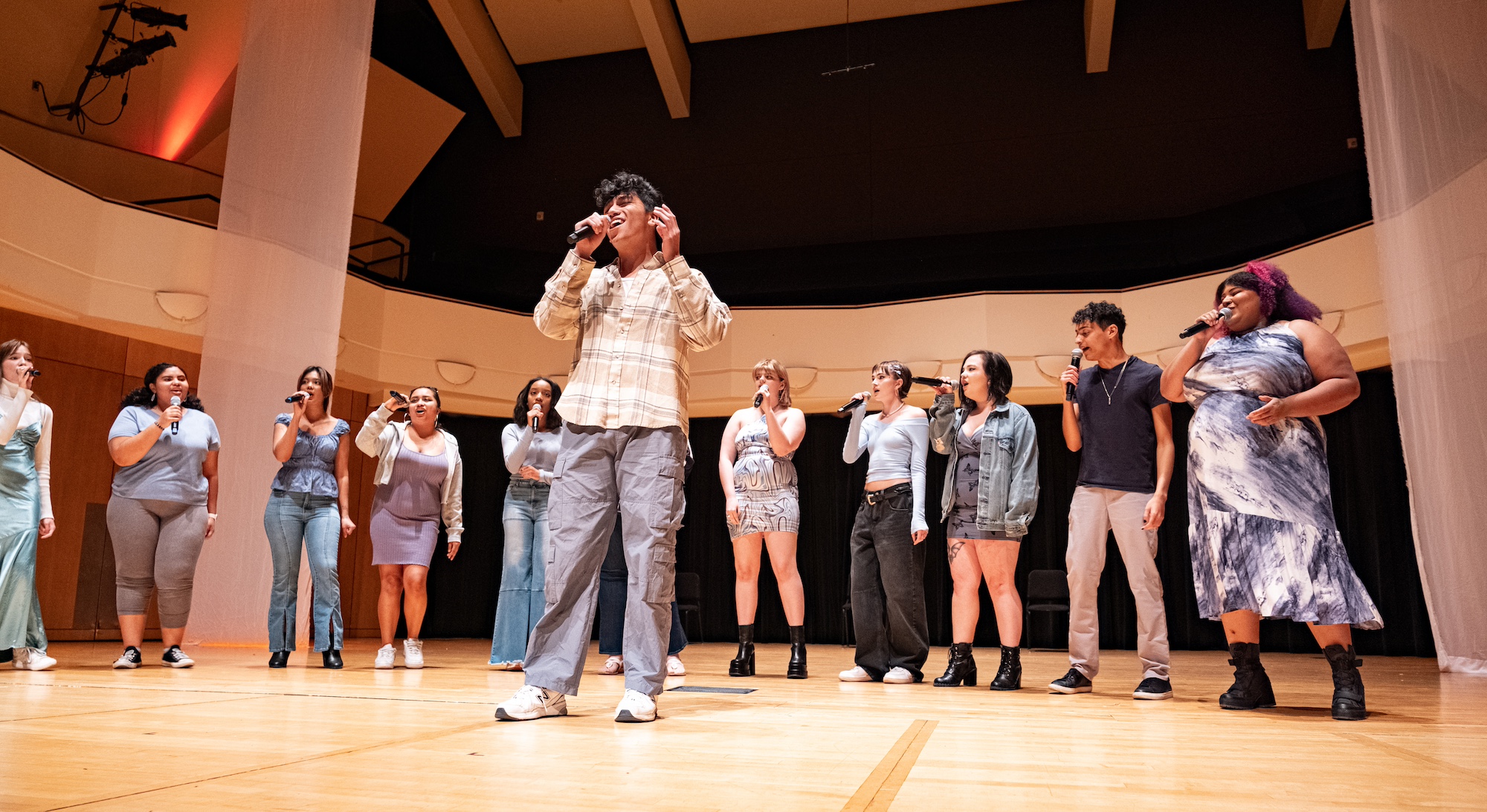 Group of current students singing a cappella