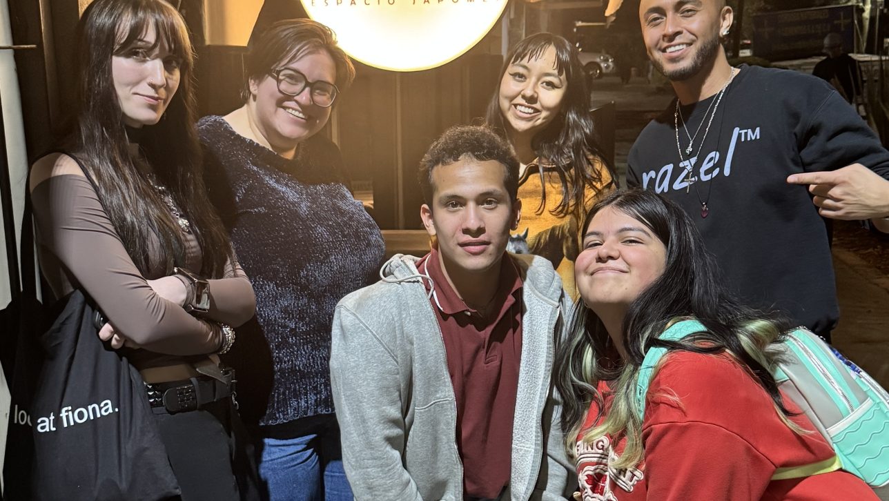 Six college students pose for a photo